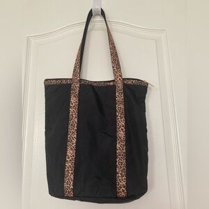 Lesportsac black tote with animal print straps